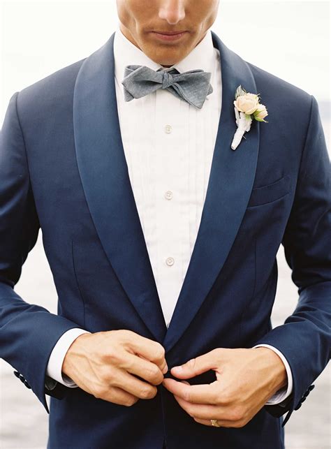 navy suit with navy bow tie